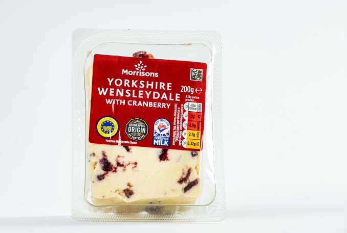 The cheese at Morrisons came with an uneven spread of cranberries - I Tried Christmas Cheese At Supermarkets Like Aldi And Asda - The Loser Will Surprise You