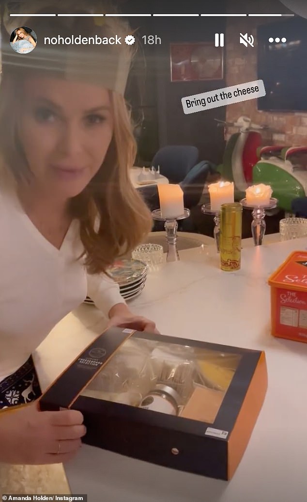 Treats: That wasn - Amanda Holden Enjoys The Festivities By Flaming A Christmas Pudding In A Busty Satin Teal Dress't the end of Amanda's treats for the evening as she broke open the box of cheeses later on after the Christmas pudding