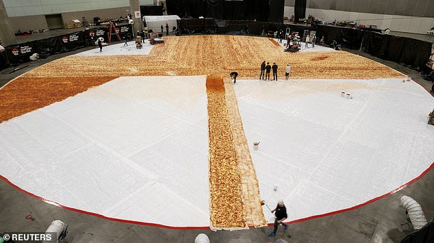 Pizza Hut Breaks The Guinness World Record For BIGGEST Ever Pizza's largest pizza required 13,653 of dough and made 68,000 slices