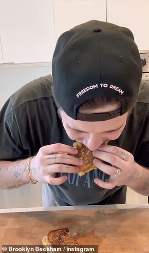 The video received mix reviews from fans, with one joking it was a - Brooklyn Beckham Gets A Roasting Over Grilled Cheese Sandwich In Another Disastrous Cookery Tutorial'culinary masterpiece' with several laughing emojis
